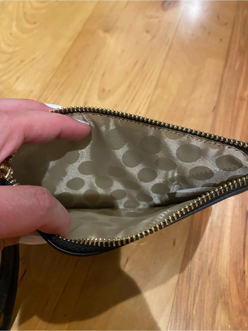 kate spade Black Pebbled Leather Lucy Wristlet with Gold Logo